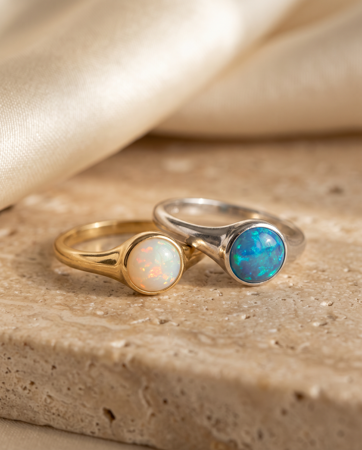 Tess & Mae Opal Rings on warm beige travertine