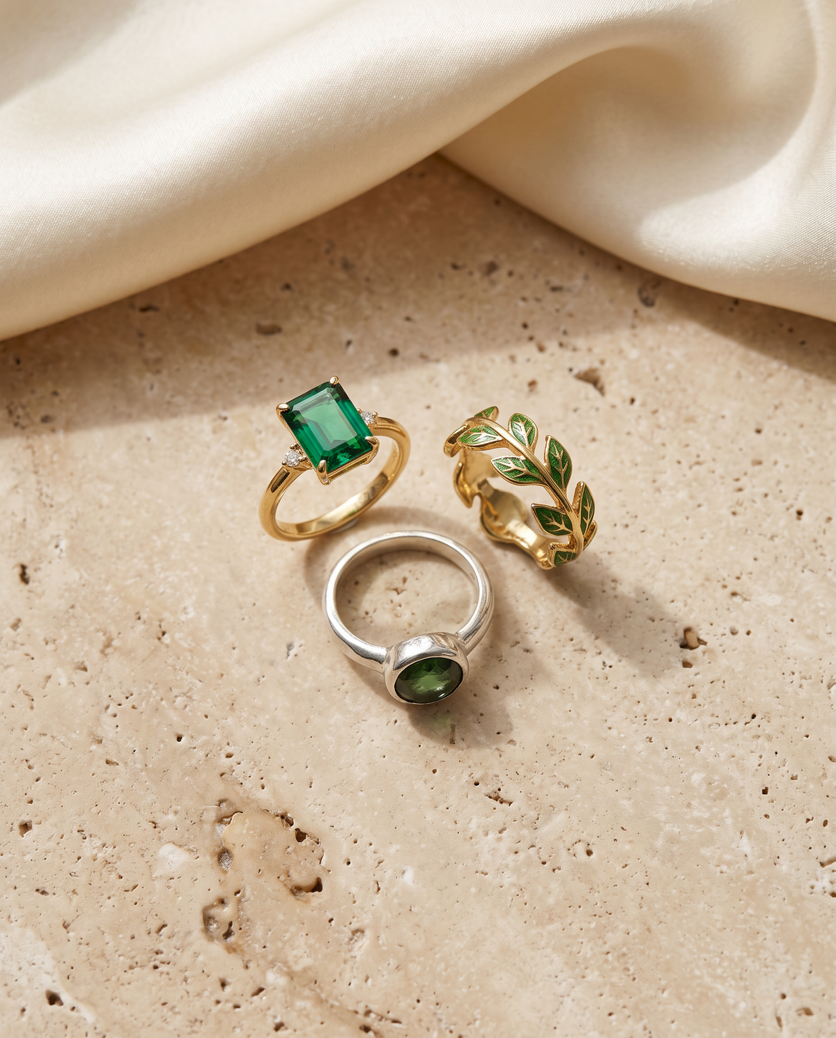 Tess & Mae Green Stone Rings on warm beige travertine