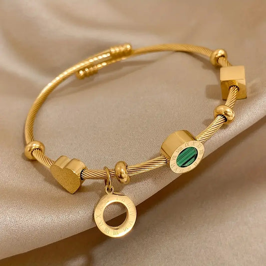 Celeste Gold Bangle with Geometric Charms